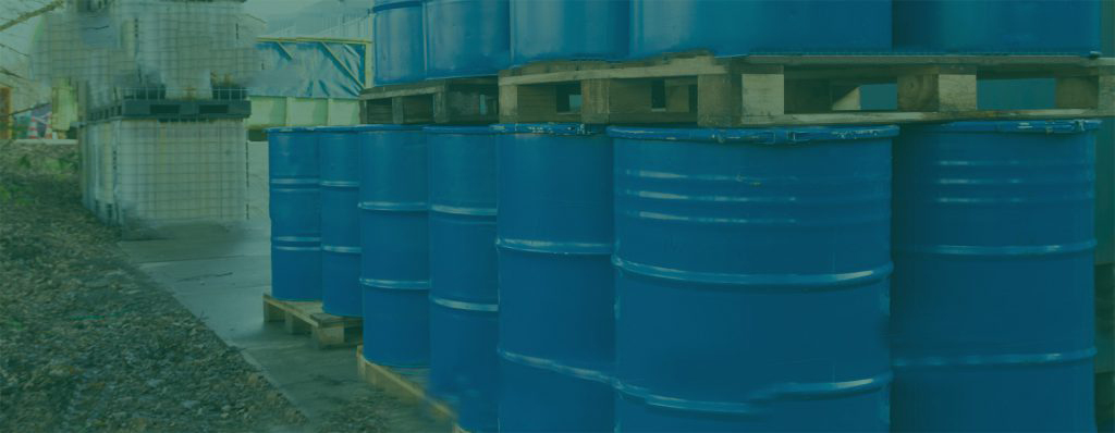 banner image of a line of blue hazardous waste barrels with a green overlay