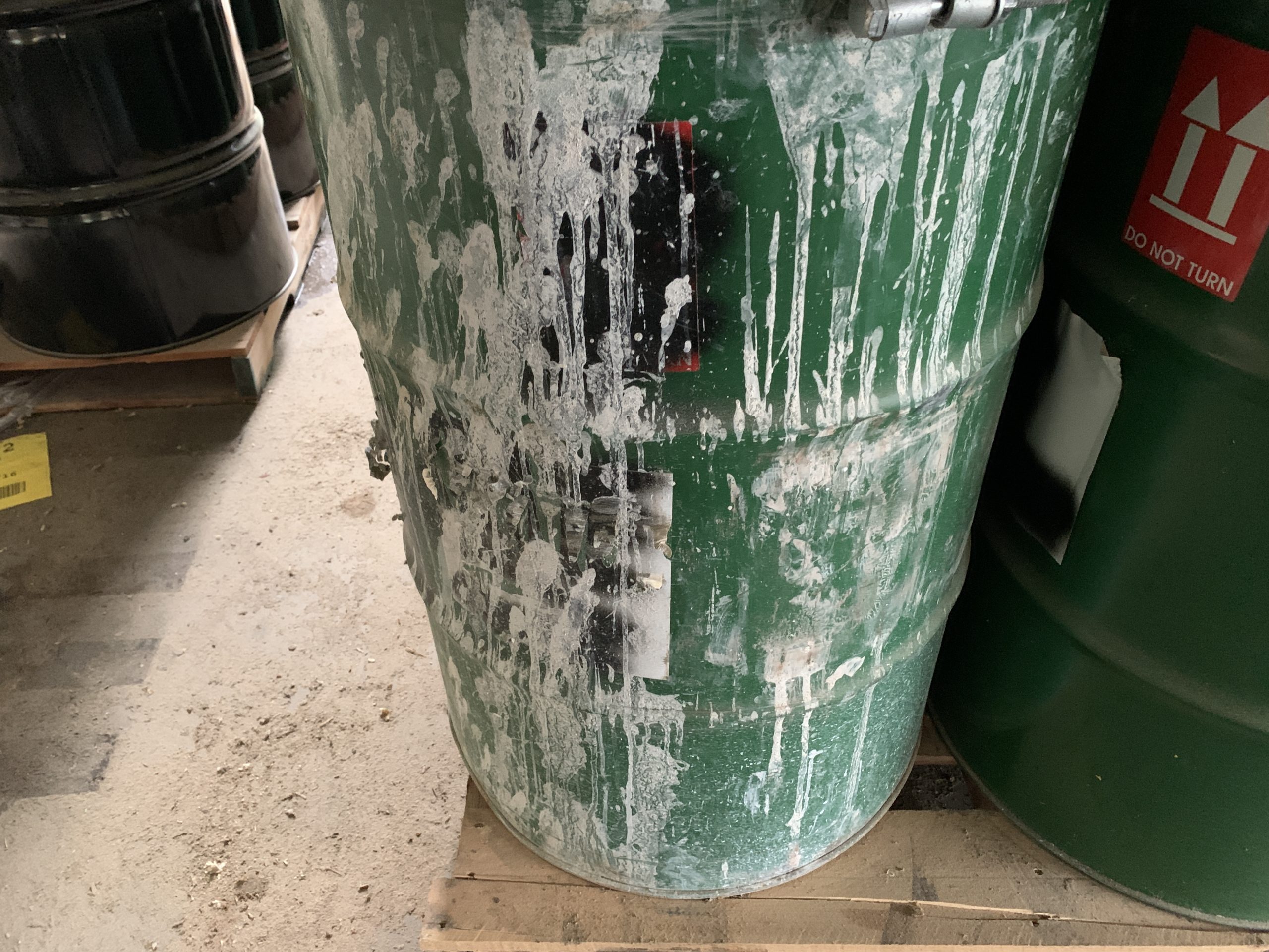 hazardous waste disposal drum labeled