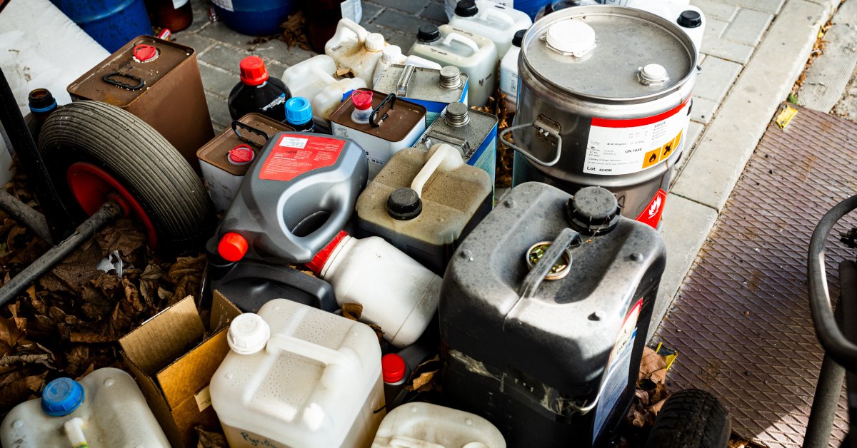 An aerial view of an assortment of differently shaped bottles and other containers for holding hazardous waste.